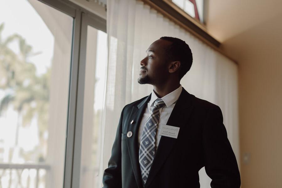 Business student looks out of window at 拼搏体育